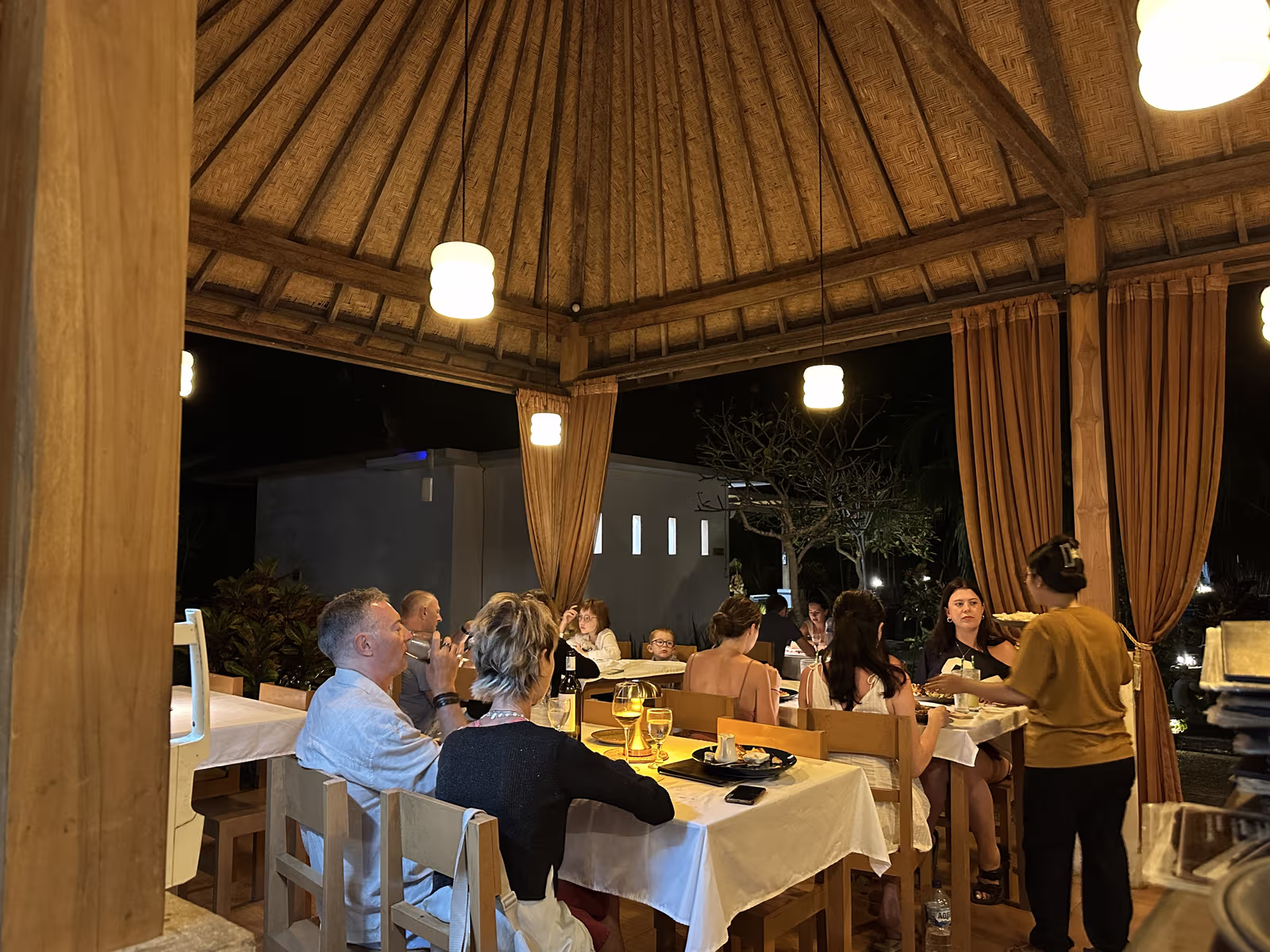 Evening dinner service inside the open-air pavilion at Kavana Penida